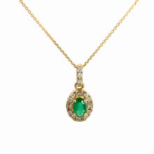 Load image into Gallery viewer, A yellow gold necklace with a pendant featuring an oval green emerald-cut center stone surrounded by a halo of small clear baguette and round-cut stones, suspended from a delicate gold chain against a plain white background.
